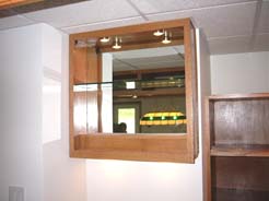 Liquor shelves & mirror above sink