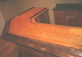 Walnut arm rail and drink ledge trim