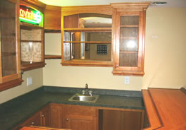 Mirrored arch-top cabinets & glass doors