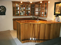 White oak "S"-shaped bar and cabinets