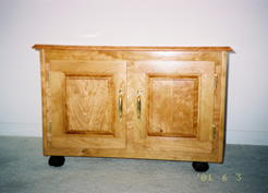 Rolling cherry cabinet, raised panel doors