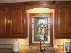 Stained glass window & arch above sink