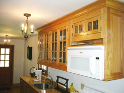 Wall cabinets accommodate microwave