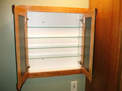 Adjustable glass shelves