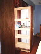 Tall pull-out with adjustable storage trays
