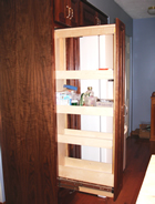 Tall pull-out with adjustable storage trays