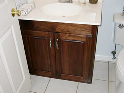 Walnut vanity off kitchen in preceding photo